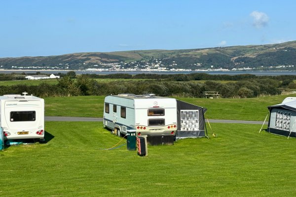 Electric Grass Pitch with motorhome set up at Ty Mawr Campsite in ynyslas.